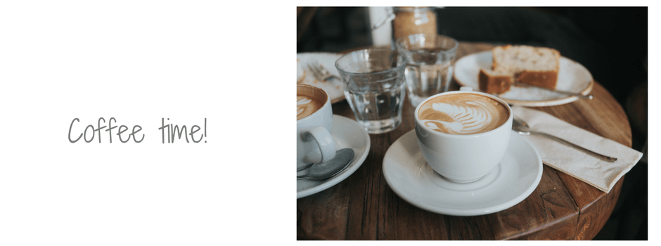 table set with 2 cups of coffee, cake and glasses