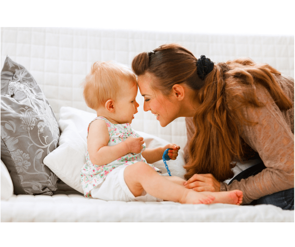 mother looking into toddler's eyes teaching how to listen