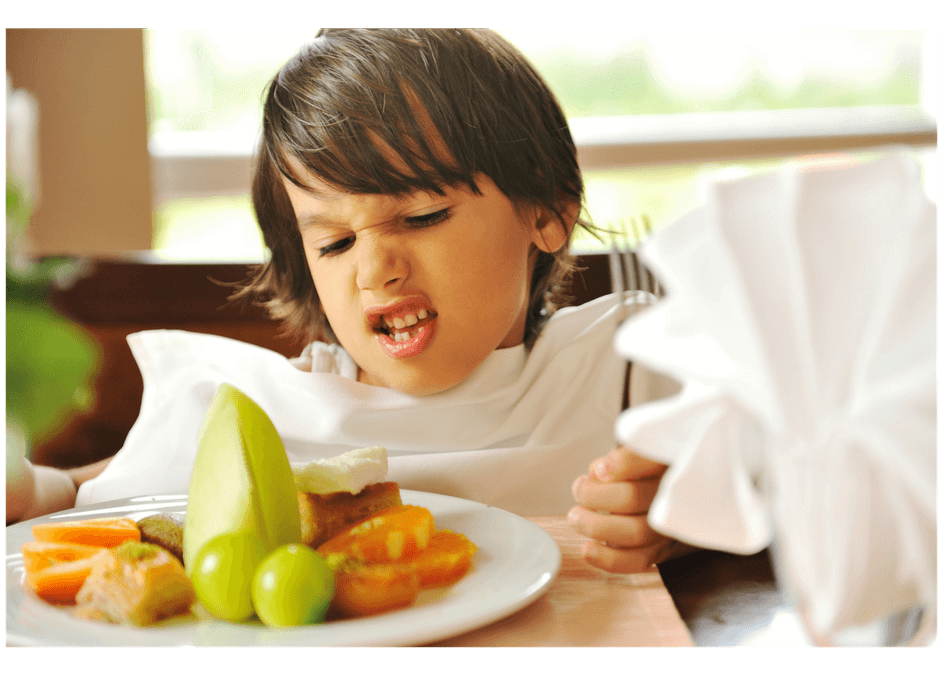 toddler making faces to healthy food