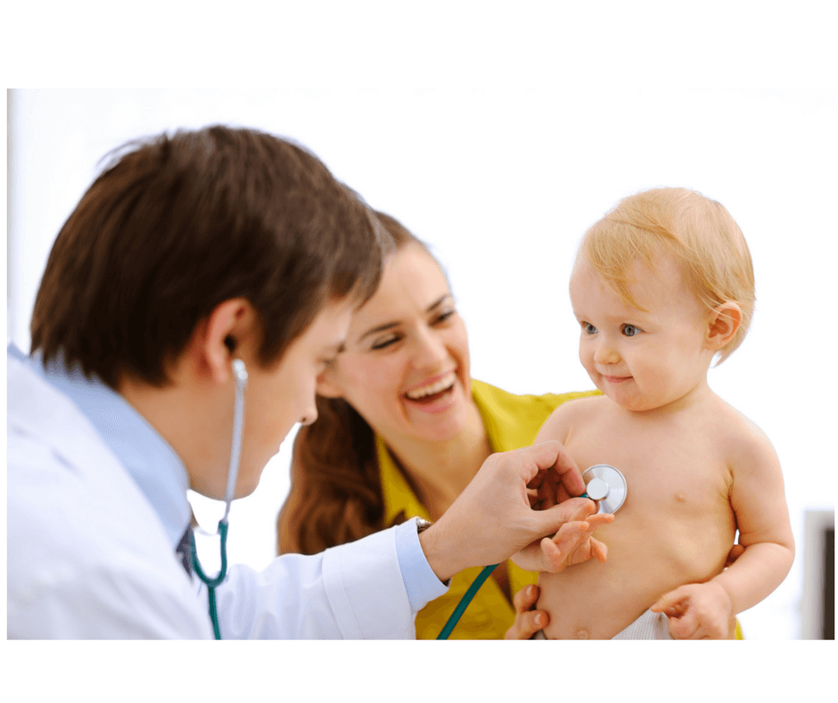 mother doctor and toddler at doctor's office, doctor checking toddler's heart beat