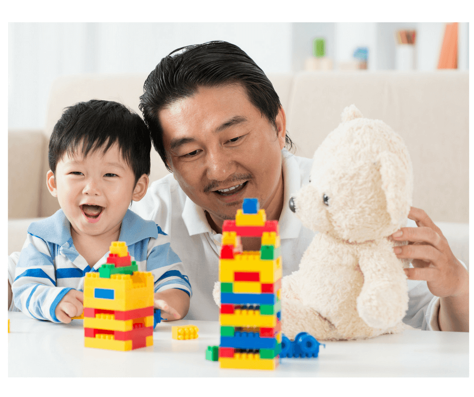 dad and child playing at doctor's office waiting room