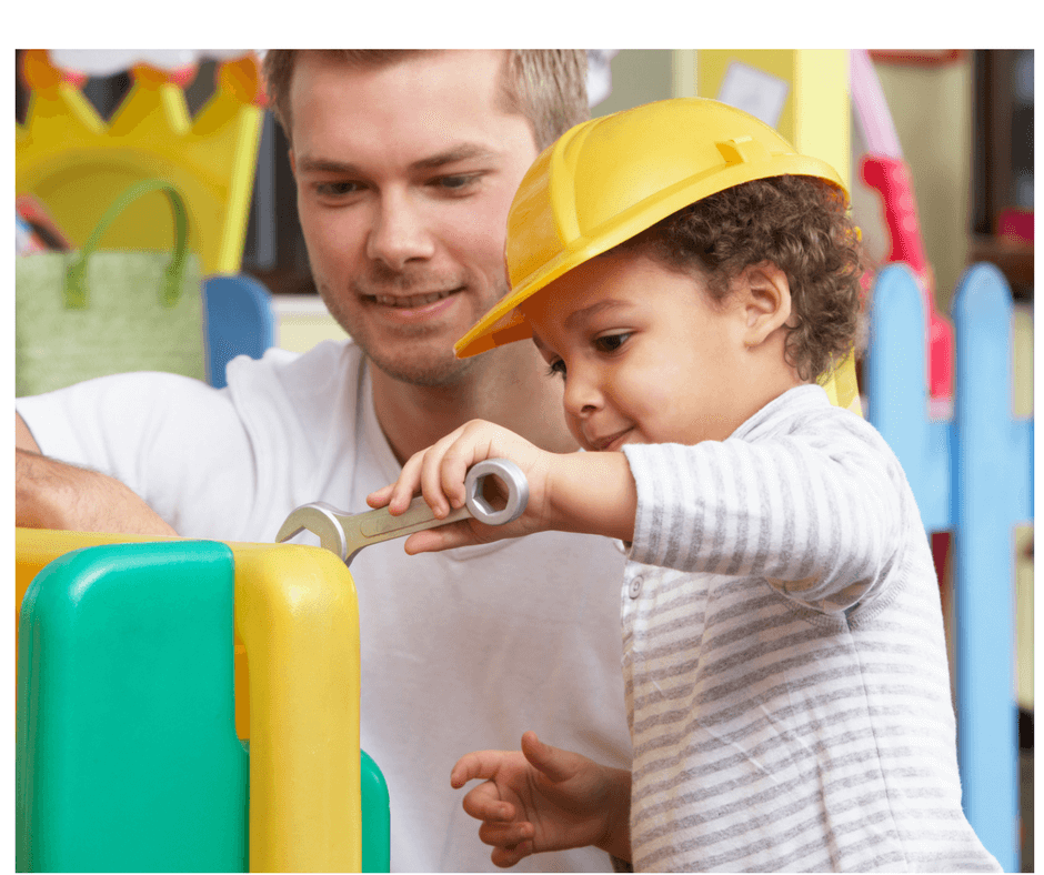 dad and toddler playing together "building"