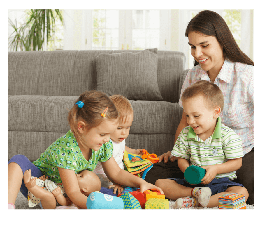 mom helping children to share during playdate