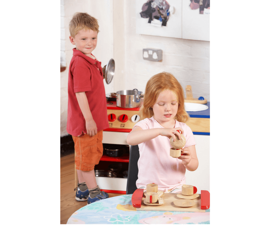 mom helping children to share during playdate