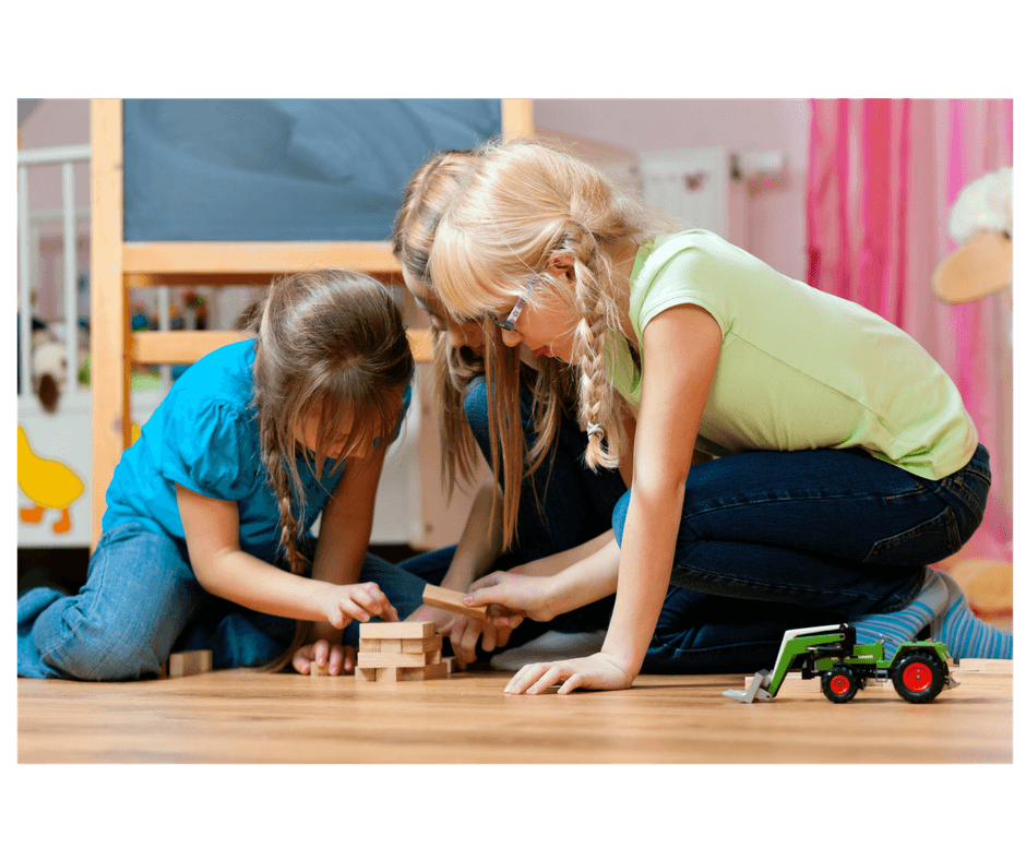 3 kids sharing builing toy