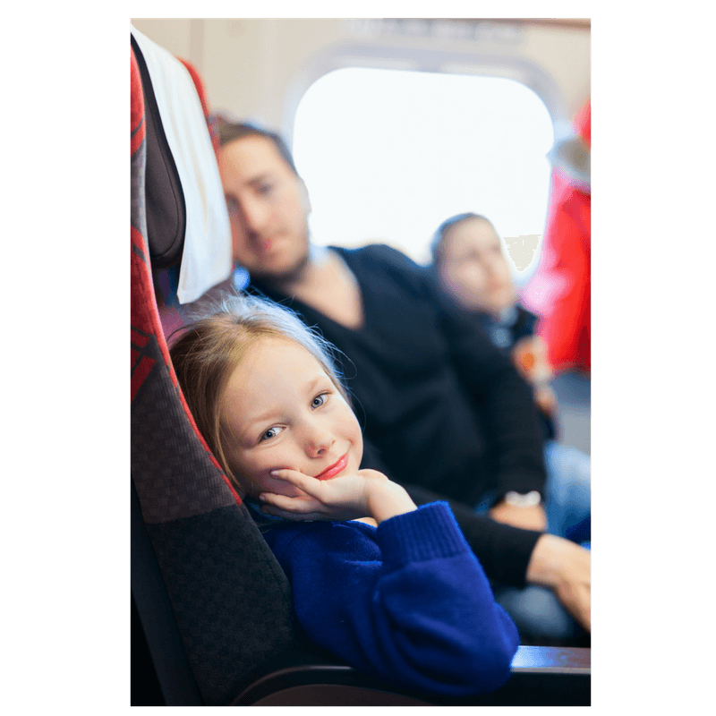 family sittign on airplane toddler girl, mom and dad