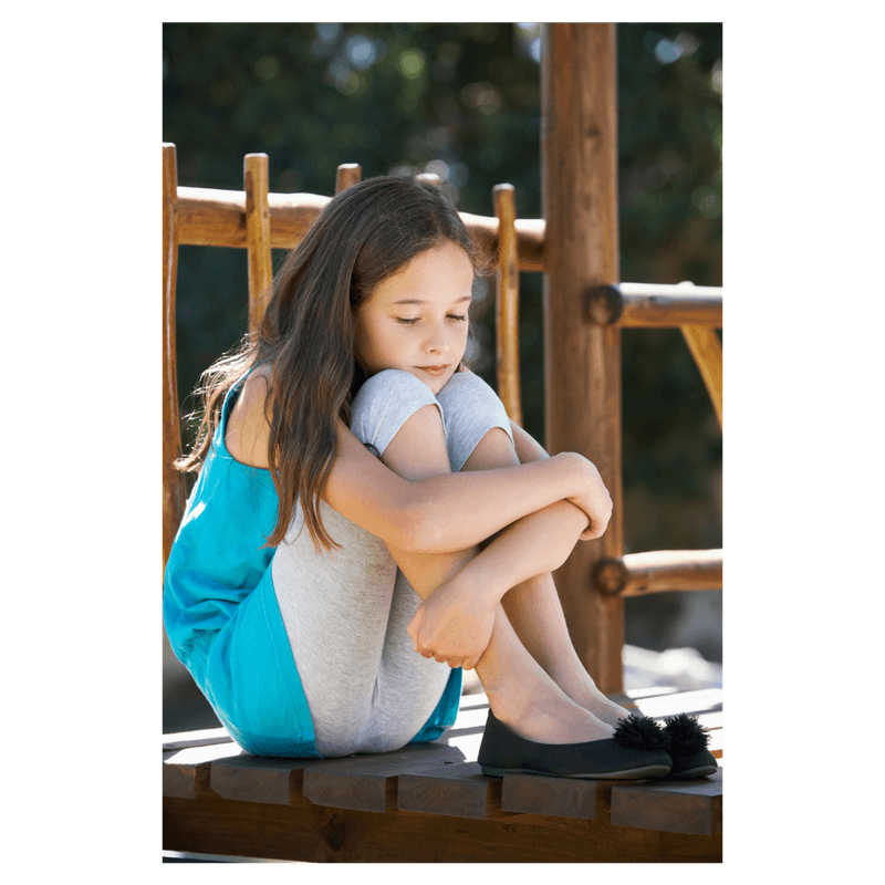 girl looking down seems worried