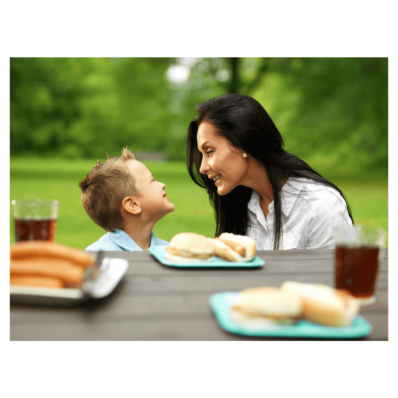 mother and son talking sitting at dinner table