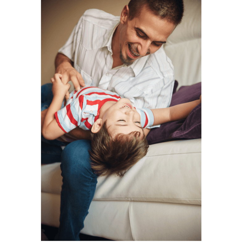 father and son playing and laughing, tickles