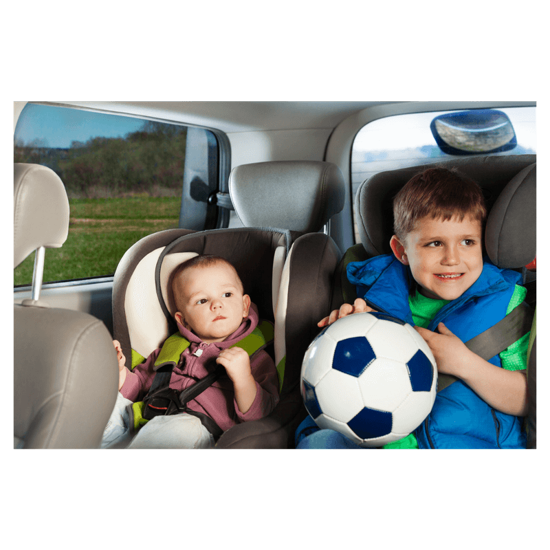 two boys sitting on car seat travelling around with family