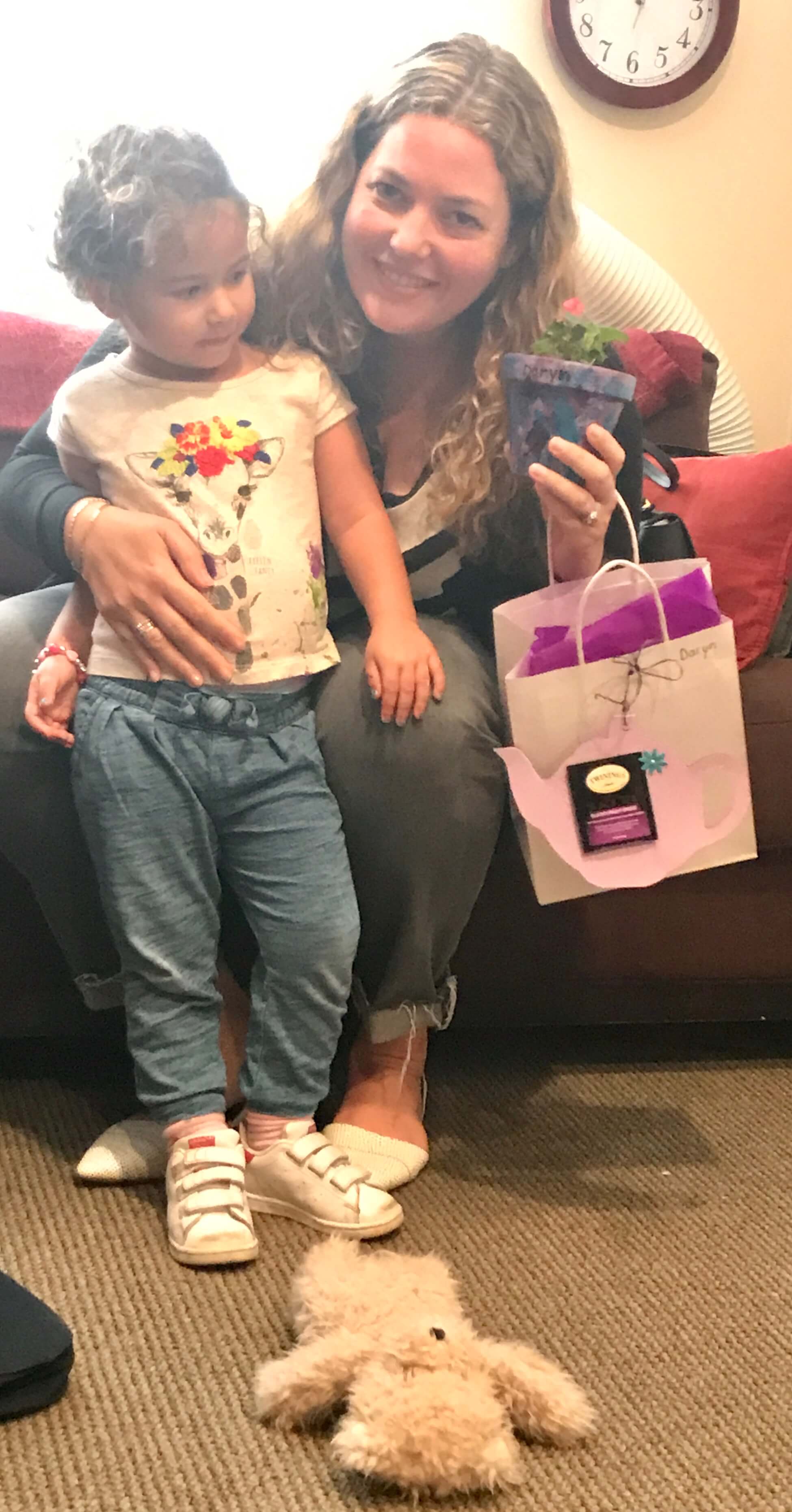 toddler giving mom a mother's day gift that he made at early childhood development associates' class