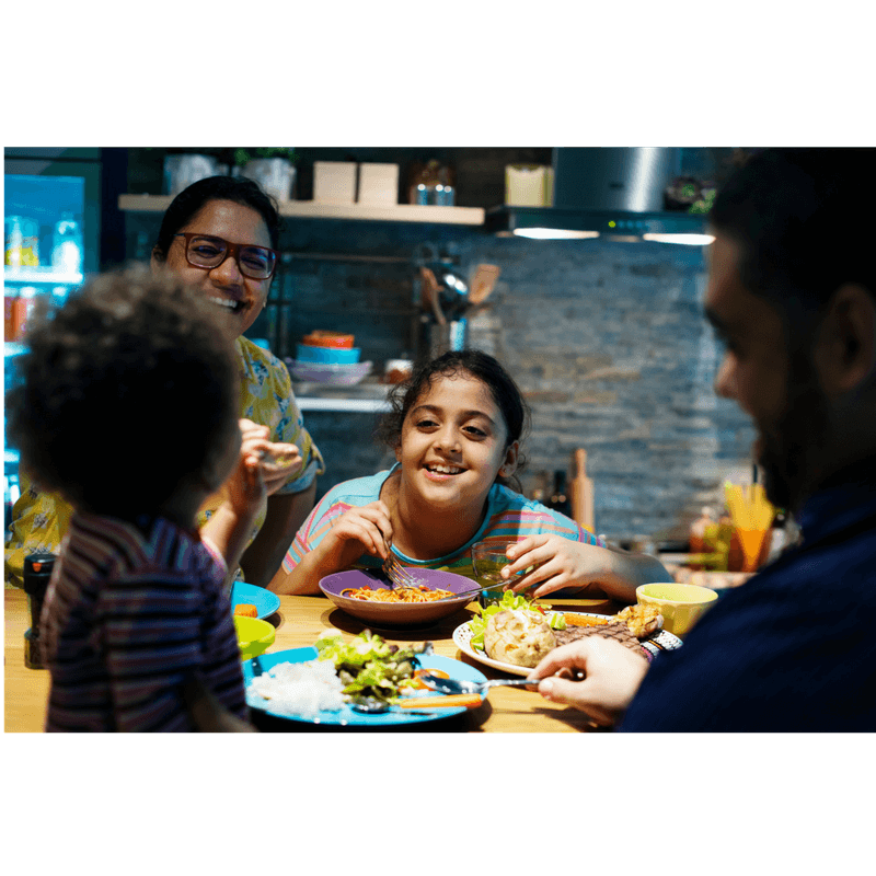 family having dinner together modeling good behavior at table