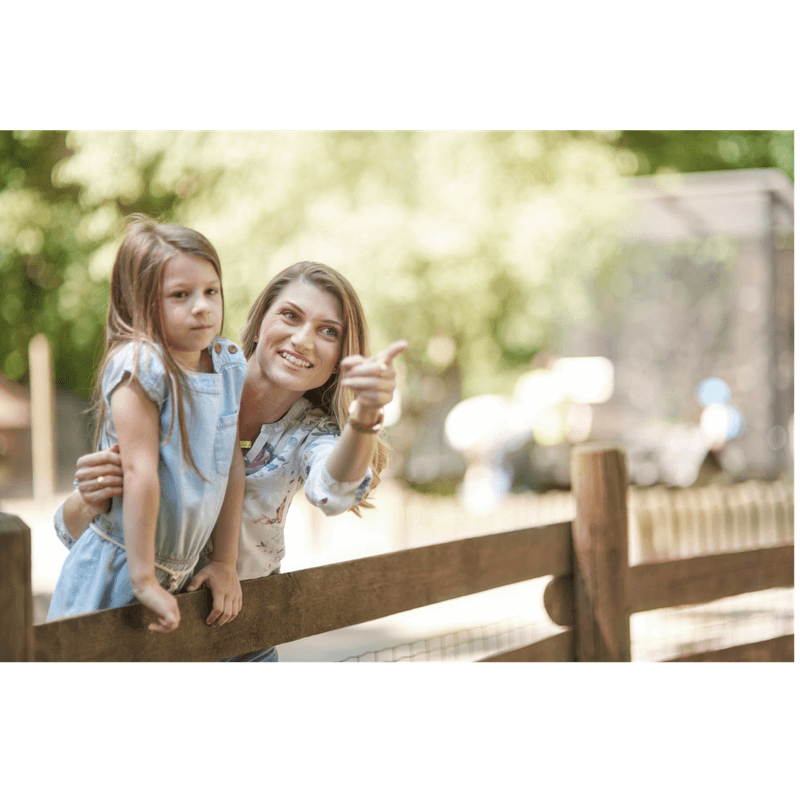 mom showing something to toddler girl