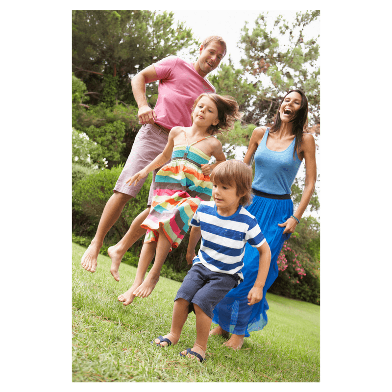 family jumping in the park 