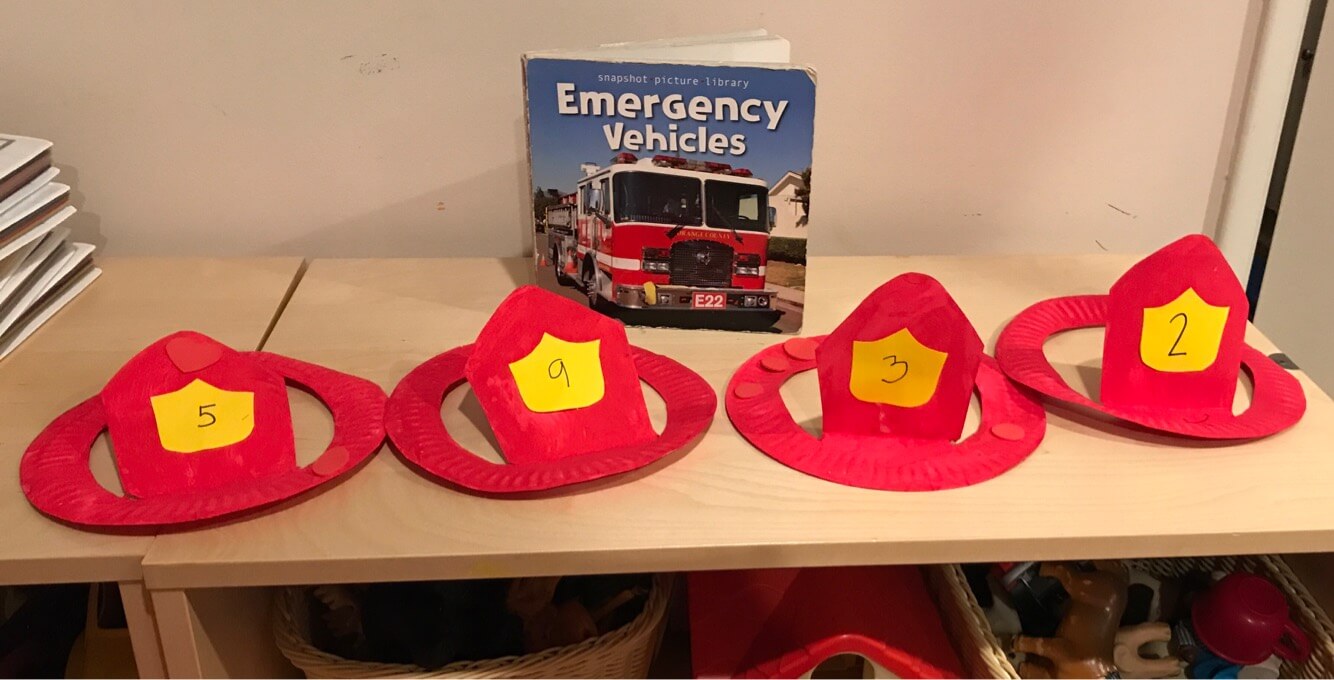 firefighter's hats made by toddlers at Early Childhood Development Associates' Class