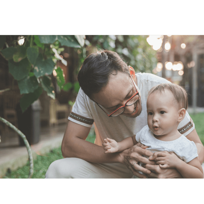 son and dad talking at the park