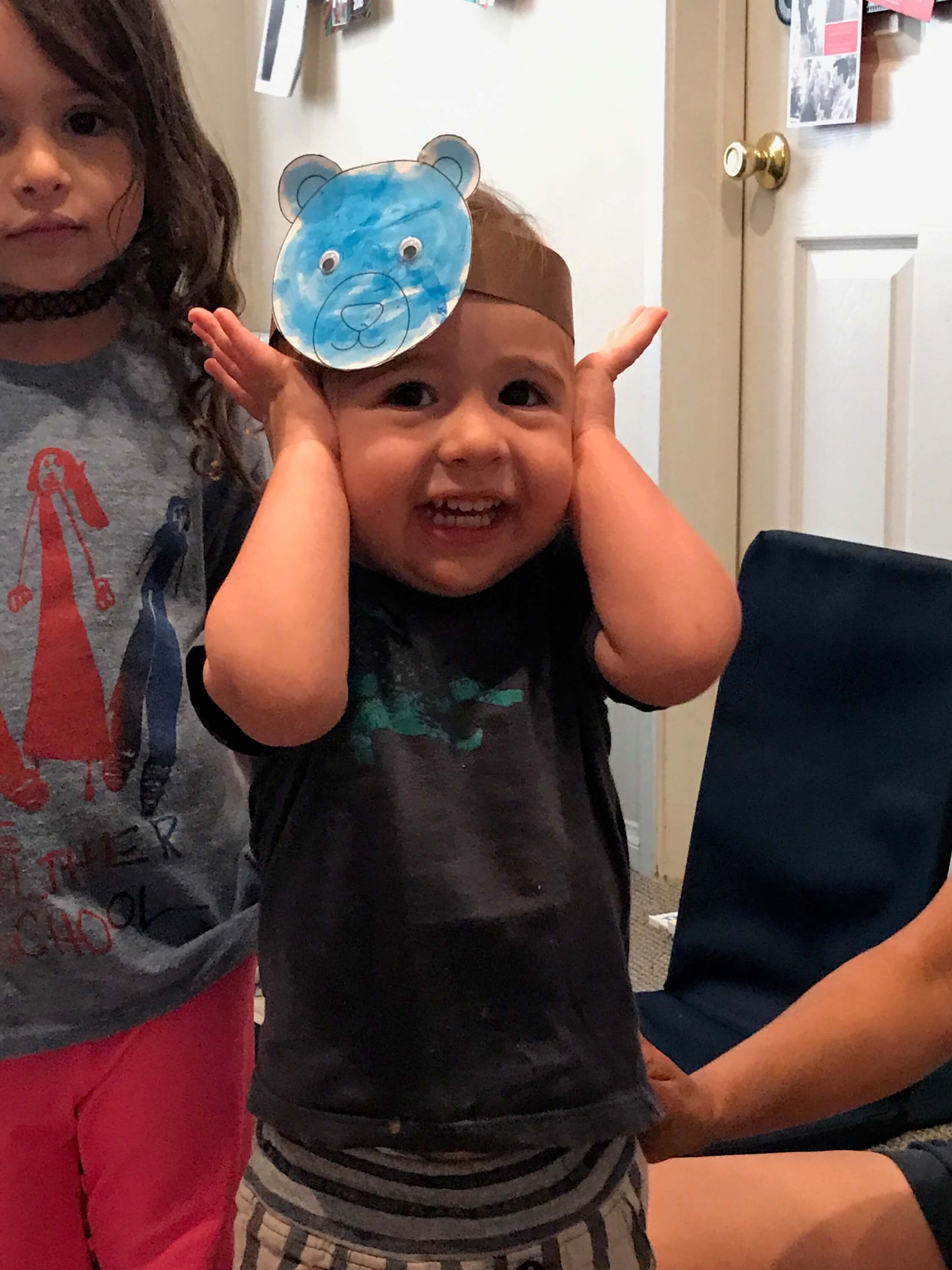 child and mom wearing tiger hat at Early Childhood Development ASsociates' class