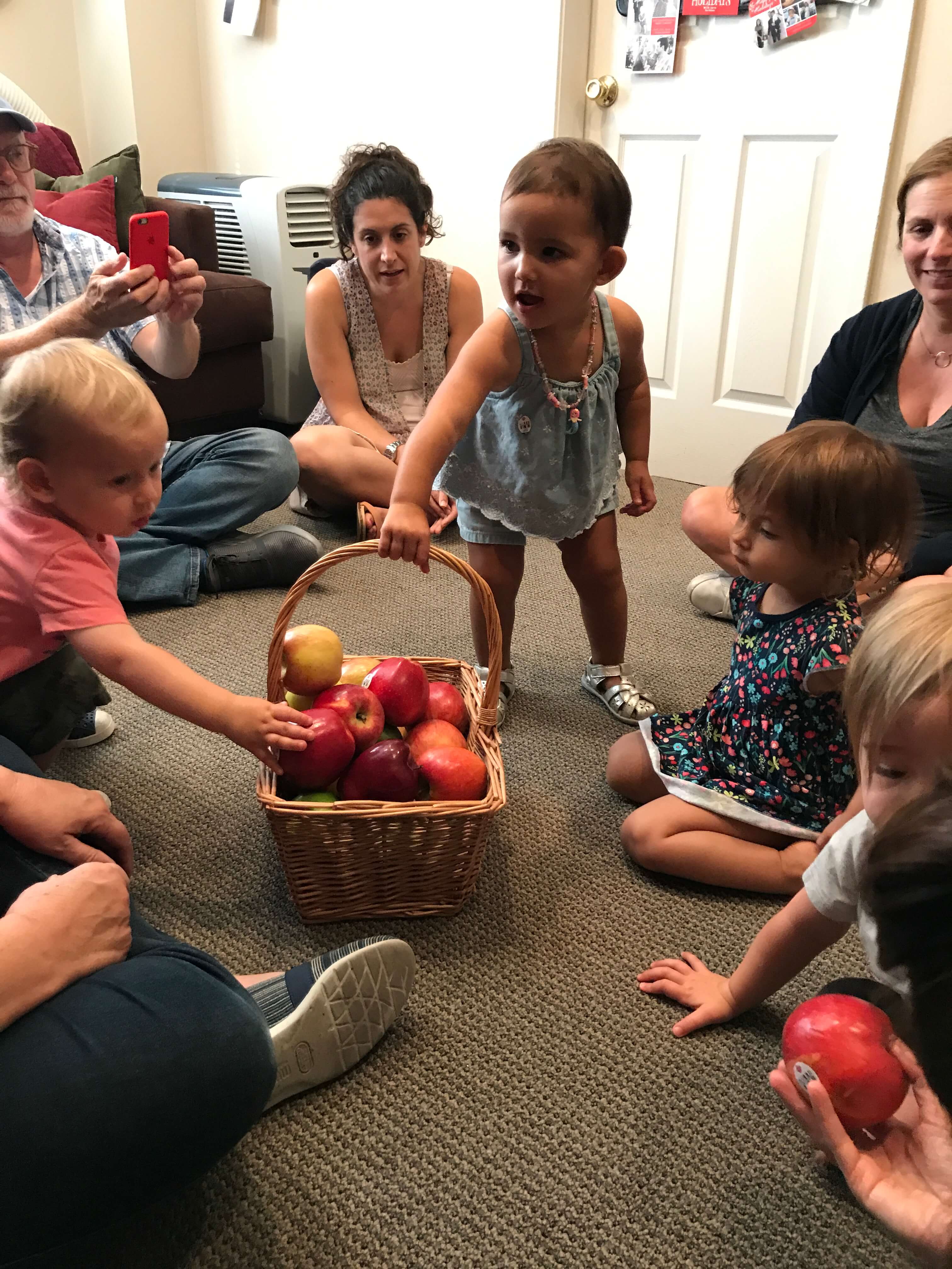 toddler girl playing wtih playdoh at early childhood development associates class