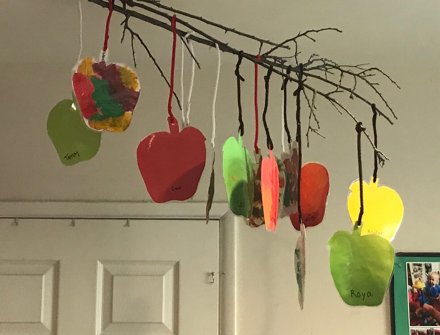 apple shaped paiting hung by the ceiling at early childhood development associates